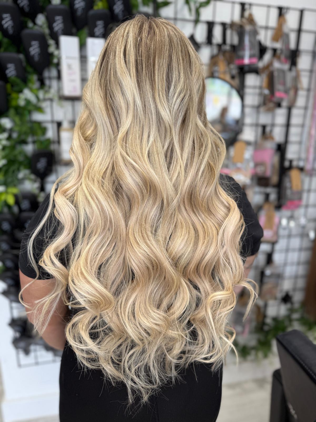 After photo of long bright blonde waves by Rebecca Jane Hair